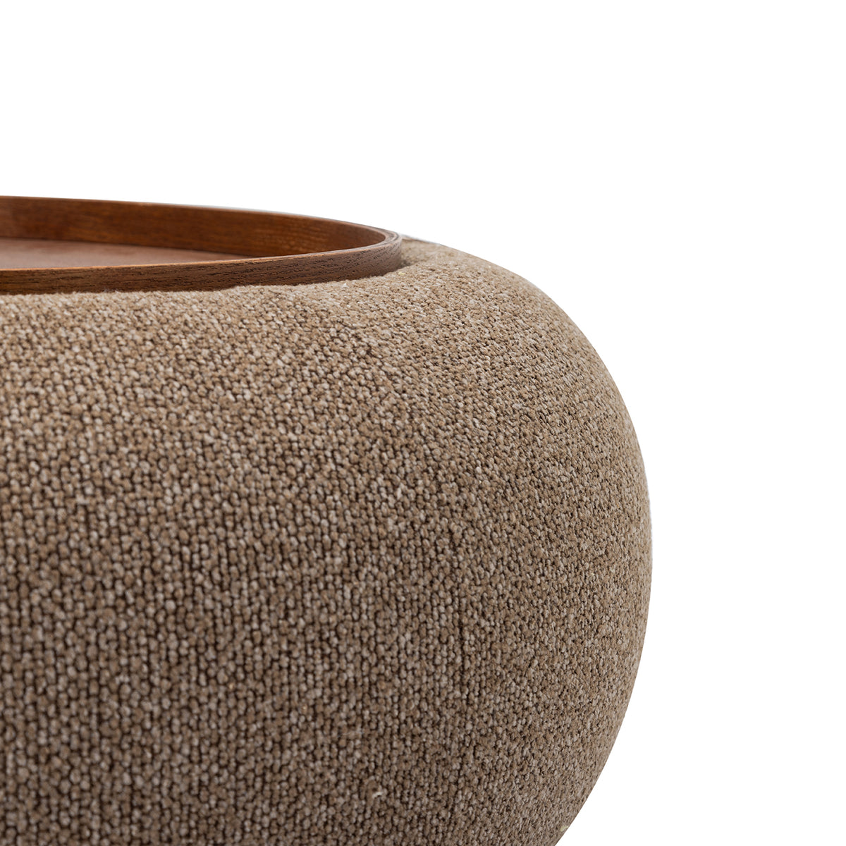 Close-up of the coffee-coloured chenille texture, curved upholstery and walnut-toned tray edge.