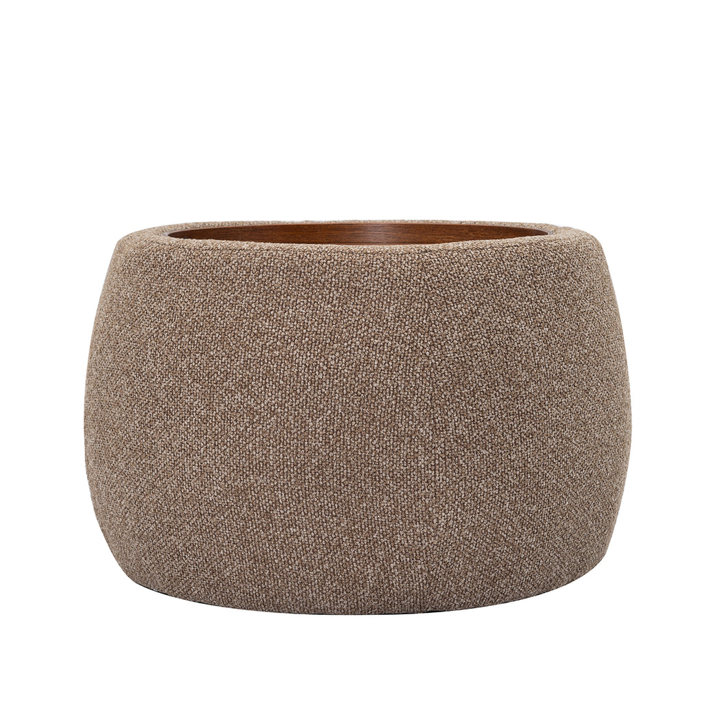 Front view of the coffee-coloured rounded storage ottoman with textured upholstery and an inset wooden tray.