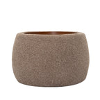 Front view of the coffee-coloured rounded storage ottoman with textured upholstery and an inset wooden tray.