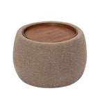 Elevated view of the ottoman showing the circular walnut-veneered tray and curved upholstered sides.