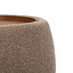 Close-up of the coffee-coloured chenille texture, curved upholstered rim and inset wooden tray edge.