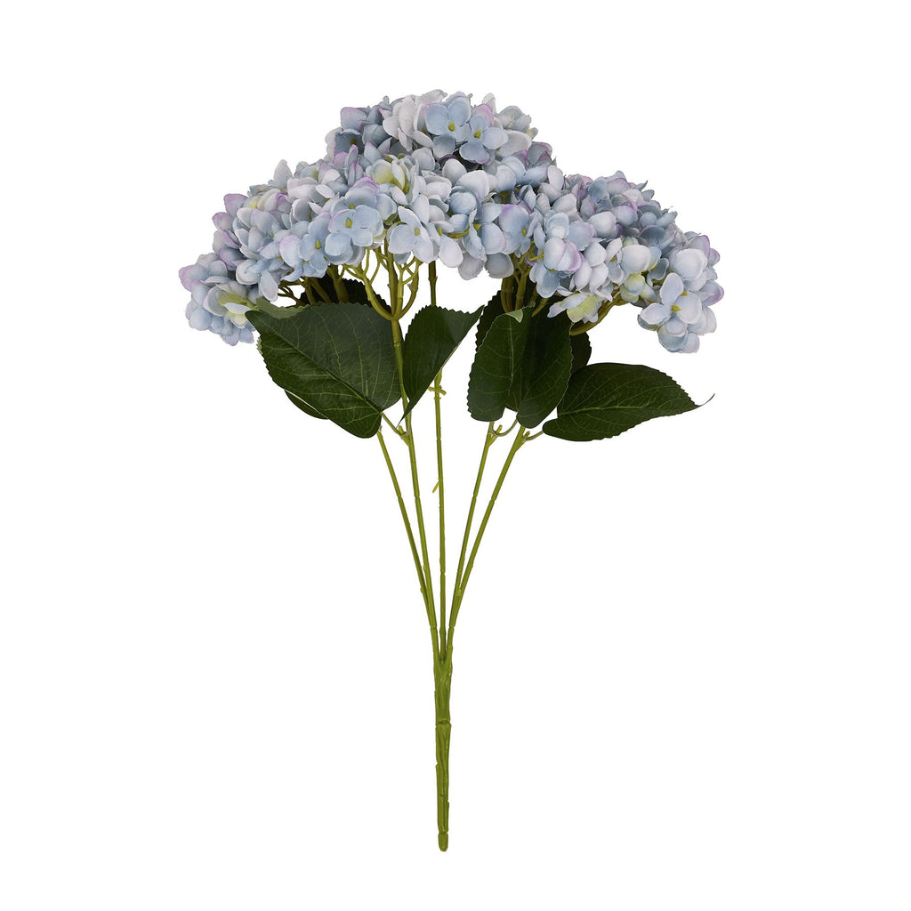 Lilac Petal artificial flower bouquet against white, showing rounded pale blue and lilac flower heads above broad dark-green leaves and grouped green stems.