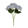 Lilac Petal artificial flower bouquet against white, showing rounded pale blue and lilac flower heads above broad dark-green leaves and grouped green stems.