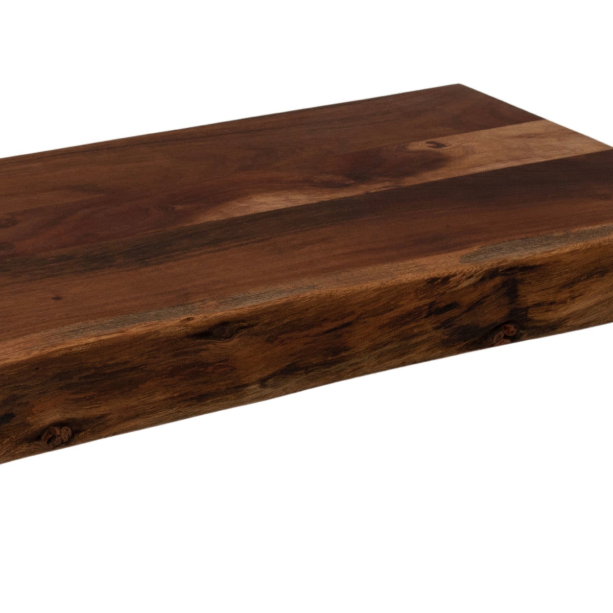 Close-up of the chopping board's front edge, showing dark textured markings beneath a flat top with contrasting light and deep brown grain.