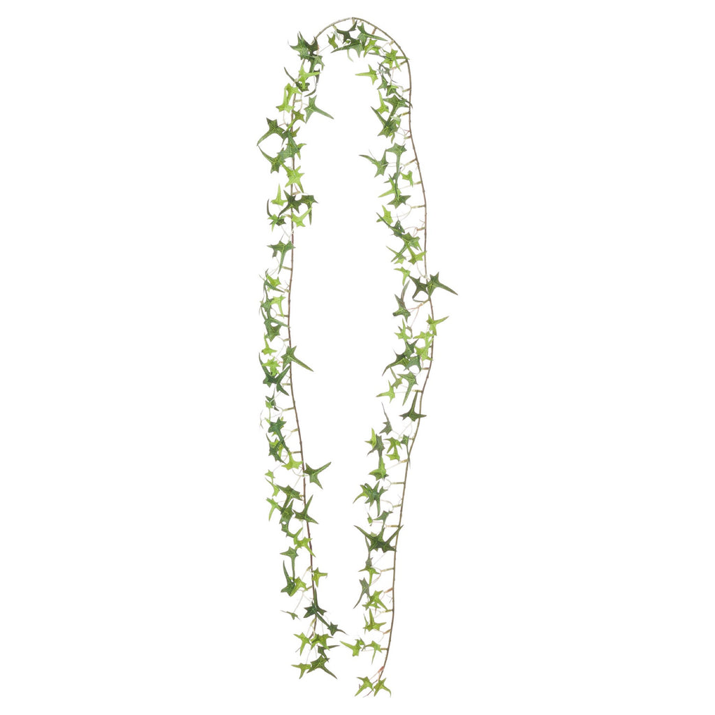 Artificial ivy garland arranged in a long narrow loop against white, with pointed leaves in varied shades of green.