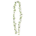 Artificial ivy garland arranged in a long narrow loop against white, with pointed leaves in varied shades of green.