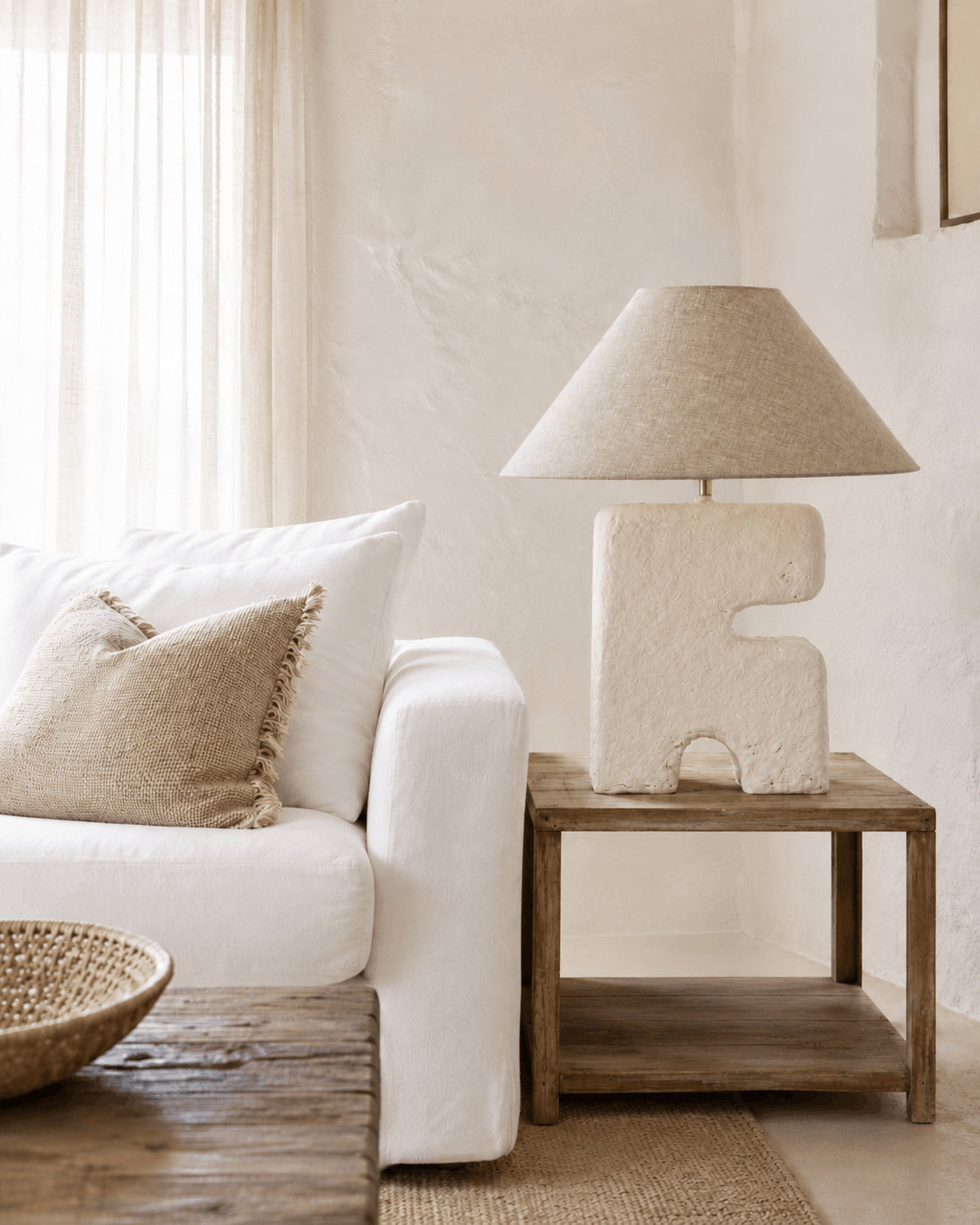 L’Objet Papier-Mâché Table Lamp – White, Large — styled in a pale living room