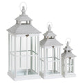 Three white rectangular lanterns shown in descending heights, with clear window panels, tiered roofs and pale loop handles.
