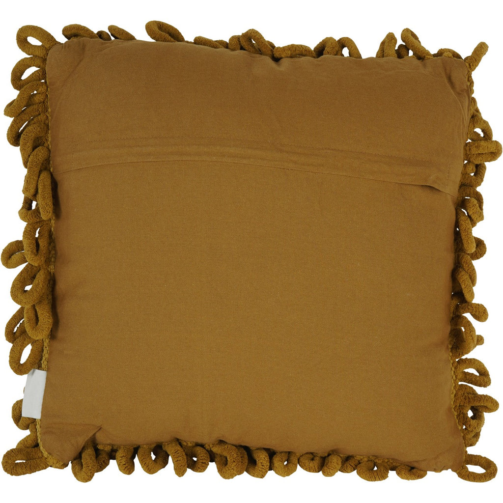 Plain mustard fabric reverse of the cushion, with an overlapping panel and curled loops visible around the edges.