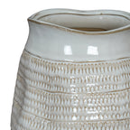 Detail of the vase's undulating rim above a smooth white band and repeated rows of recessed loop impressions.