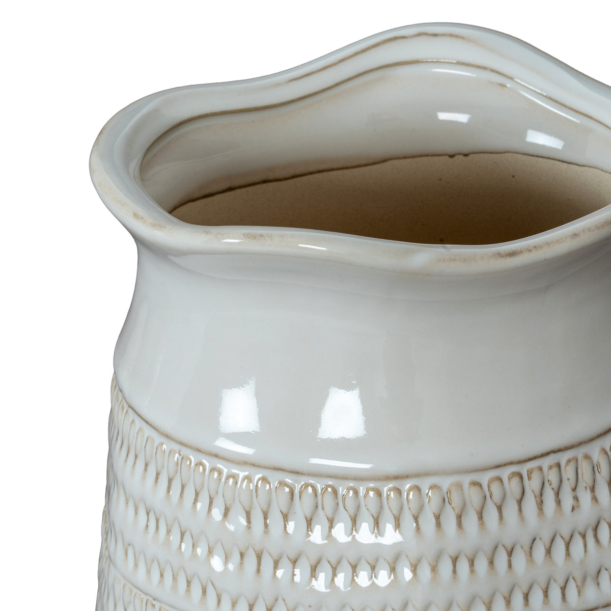 Angled close-up looking into the vase's broad wavy opening, with beige edging and a smooth white neck above the patterned body.