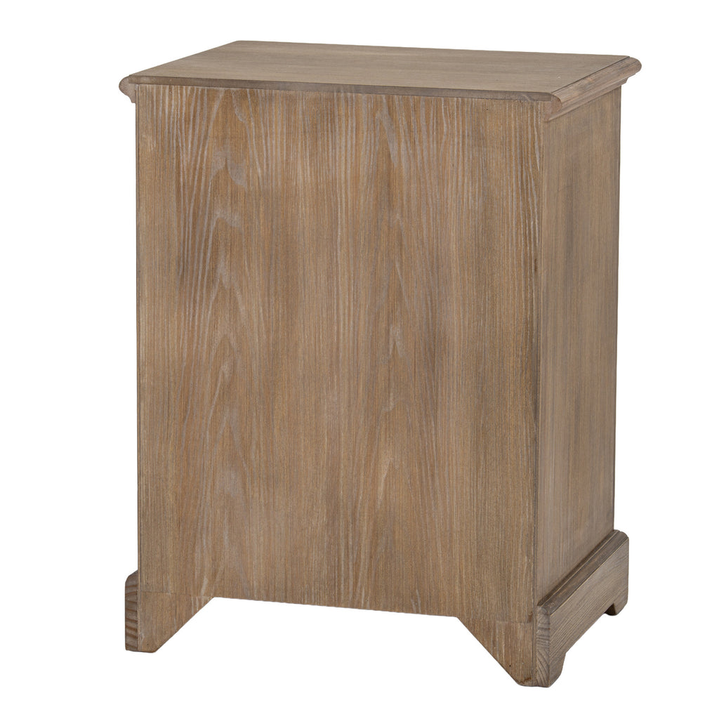 Rear three-quarter view of the chest, showing a plain back with vertical grain, the side panel and shaped base.