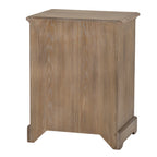 Rear three-quarter view of the chest, showing a plain back with vertical grain, the side panel and shaped base.