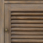 Close-up of the louvred door's horizontal slats, brown surface texture, surrounding frame and dark round pull.