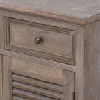 Detail of the closed drawer, rounded top edge and louvred door, with pale grain lines across the brown finish.