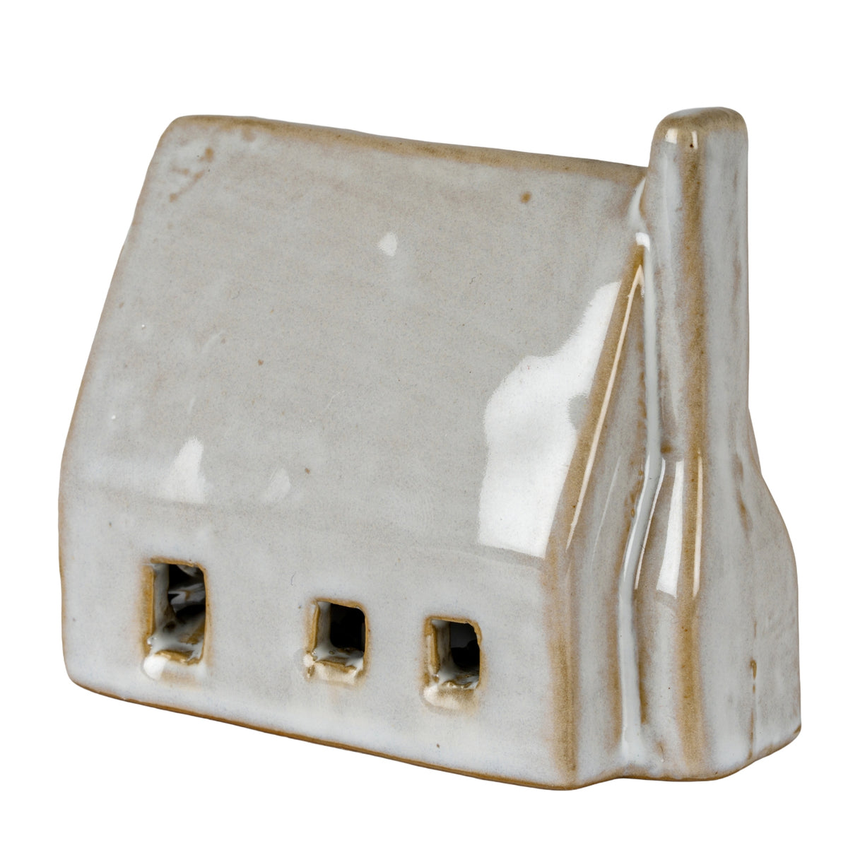Off-white barn-shaped decoration viewed at an angle, with three wall openings, a broad pitched roof and a rounded chimney on the right.