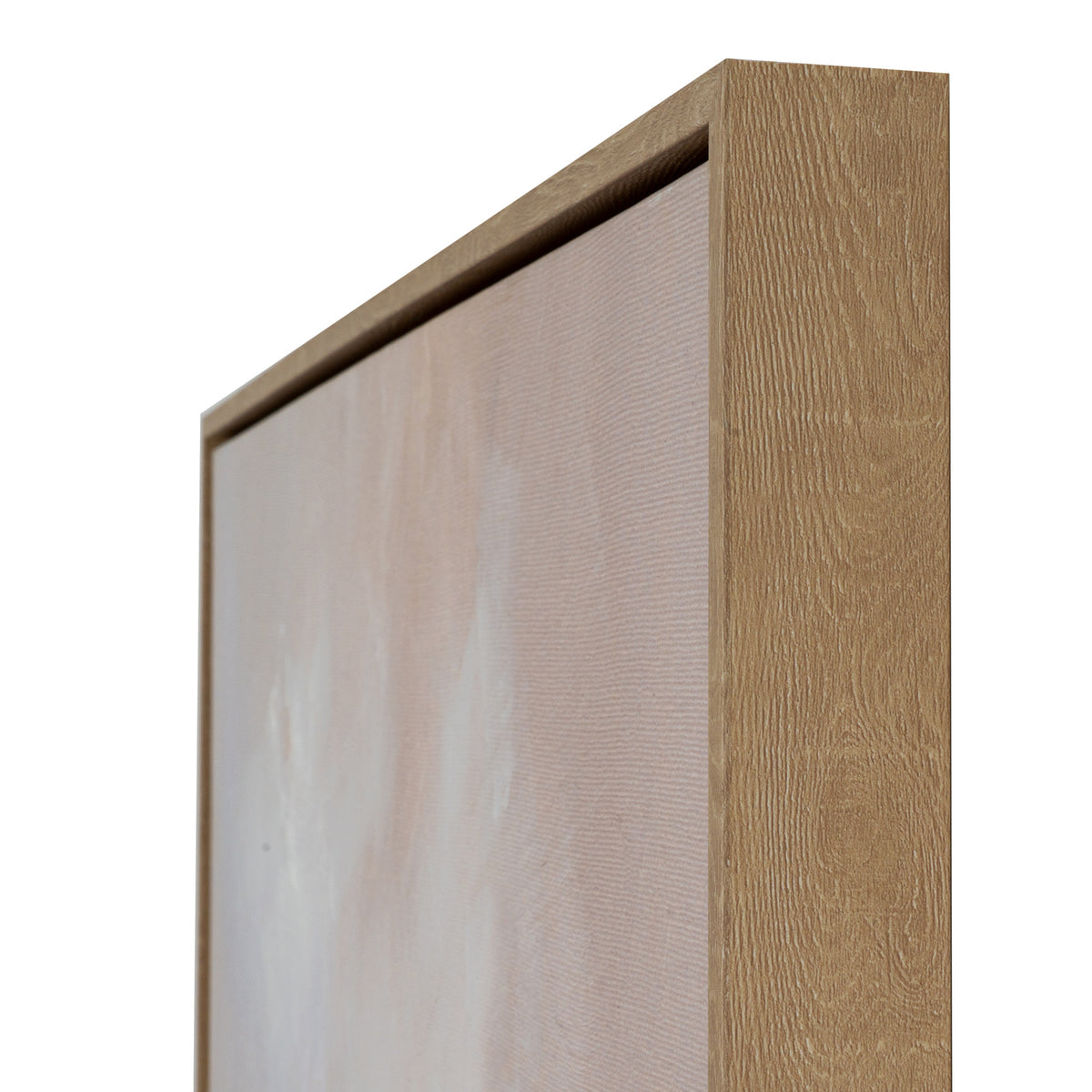 Angled close-up of the upper right corner, showing the wood-grain effect on the frame beside the pale canvas surface.