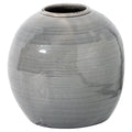 Grey rounded vase with a low circular opening, fine crackle pattern and dark patches at the rim and base, shown against white.
