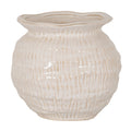 Cream vase viewed slightly from above, showing a wide wavy rim, pinched neck and rounded body covered in rows of vertical marks with tan accents.