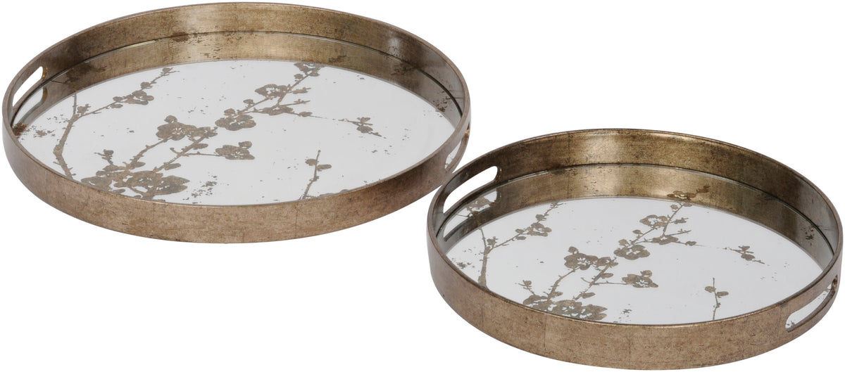 Two round trays of different sizes on a white background, with antique-gold surrounds, oval hand openings and mirrored blossom-patterned surfaces.