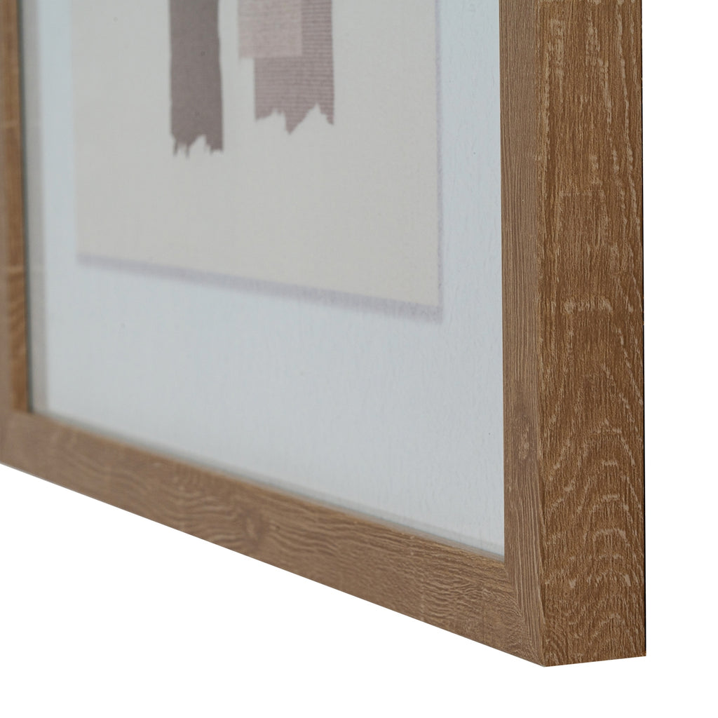 Angled detail of the brown frame's right side and lower edge, with the pale mount and uneven ends of the abstract blocks visible behind it.
