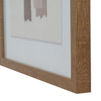 Angled detail of the brown frame's right side and lower edge, with the pale mount and uneven ends of the abstract blocks visible behind it.