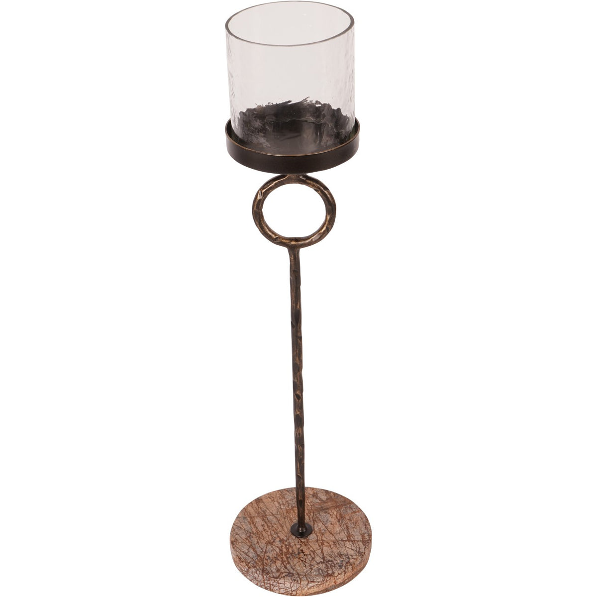 Elevated view showing the open glass cylinder, shallow metal cup and branching veins across the marble base.