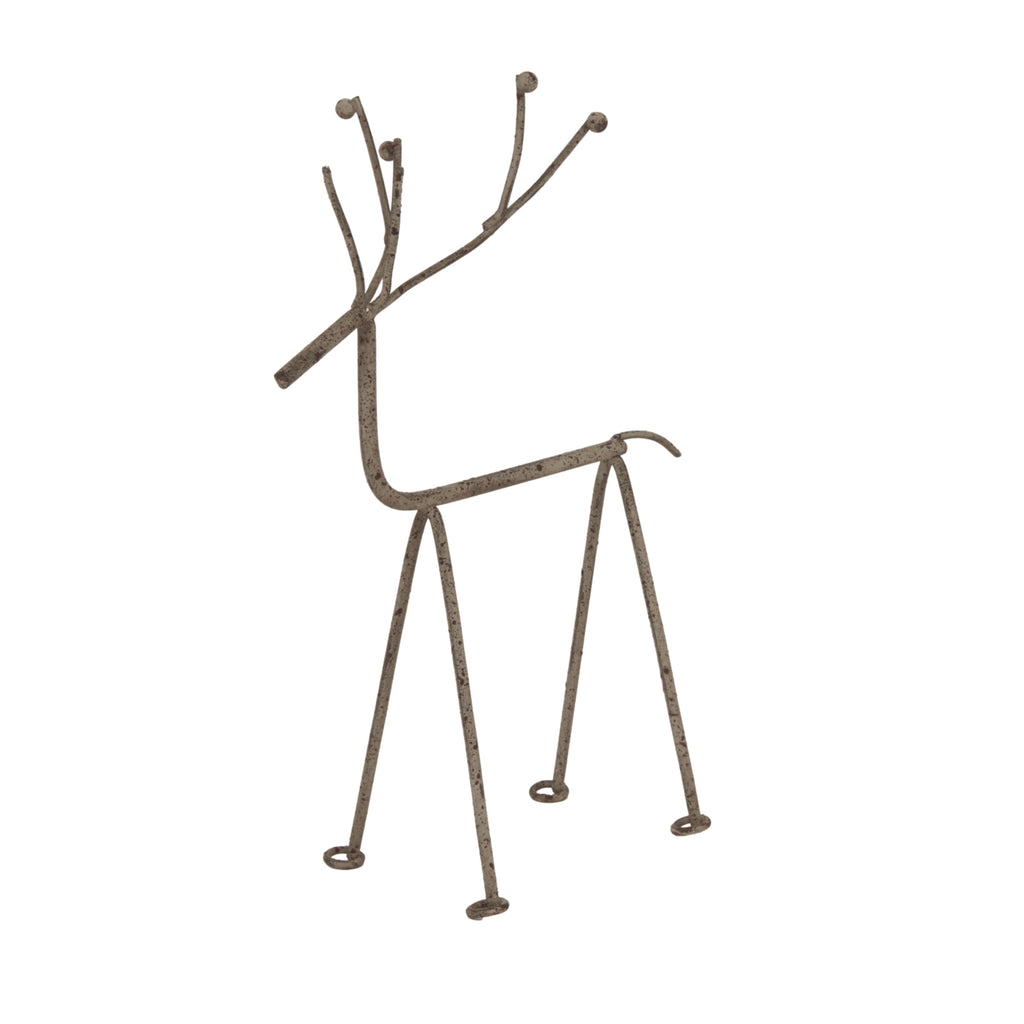 Distressed grey reindeer decoration viewed at an angle, showing branching antlers, four slender legs and small circular feet.