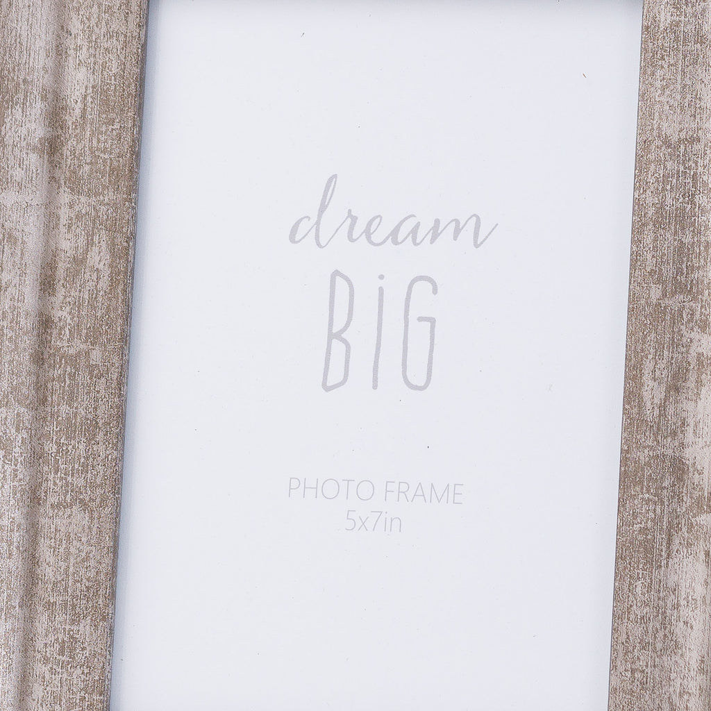 Close-up of the frame's rubbed silver-grey side borders around a white dream big placeholder marked photo frame 5x7in.