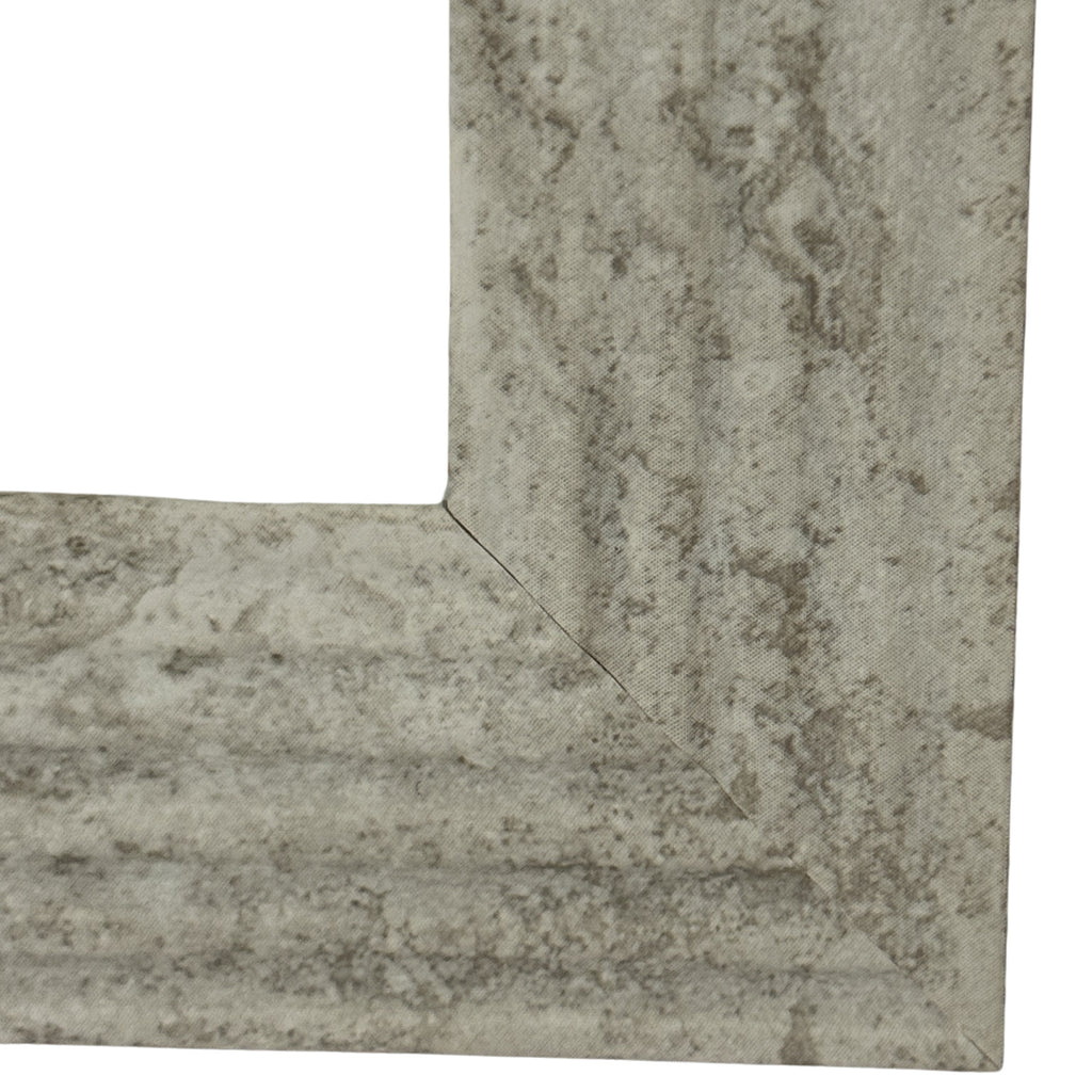 Close-up of the frame's lower mitred corner, showing pale grey-beige mottling and the inset profile.