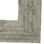 Front corner detail showing the diagonal mitred join and grey mottling across the frame's inset ridge and broad outer border.