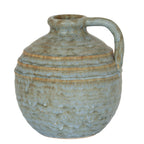 Round mottled jug vase with three raised shoulder bands, a rolled rim and a broad handle on the right.