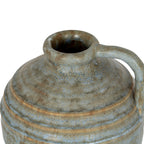 View from above of the jug vase opening, showing the thick rounded lip and blue-grey and brown mottling across the shoulder.