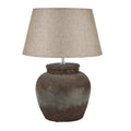 Mottled Pot Table Lamp with a dark rounded base, bright narrow neck and beige tapered shade against a white background.