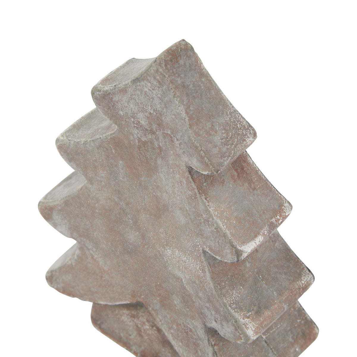 Angled close-up of the tree ornament's pointed top and thick curved tiers, showing pale mottling across the brown surface.