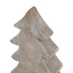 Close-up of the tree ornament's pointed top and thick branch tiers, showing pale mottling and light edges.