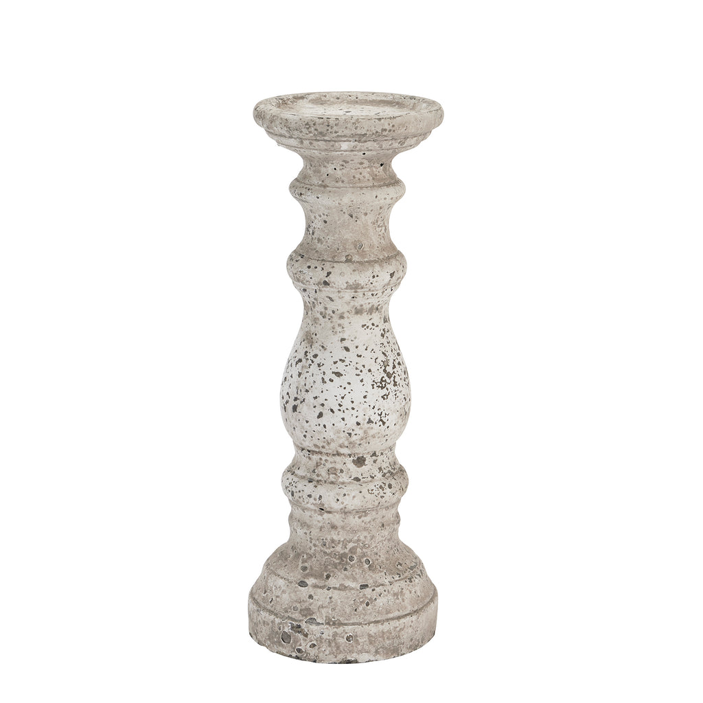 Full view of the stone-toned candle holder with a rounded central bulb, narrow waists and stepped circular base against white.