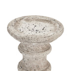 Close-up of the candle holder's broad shallow top recess, showing grey and charcoal mottling, pits and rubbed pale patches.