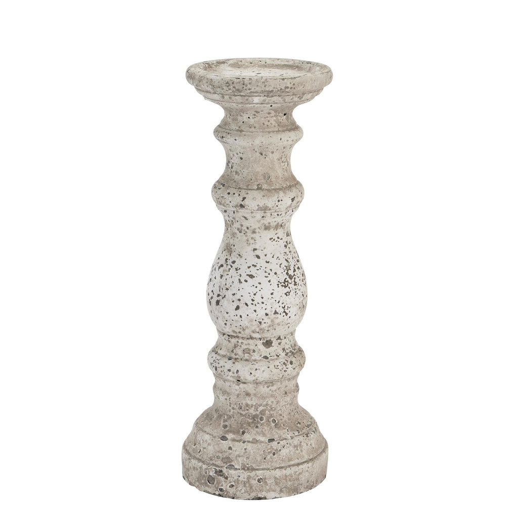 Full view of the pale mottled candle holder with rounded sections, narrow waists and a stepped circular foot against white.