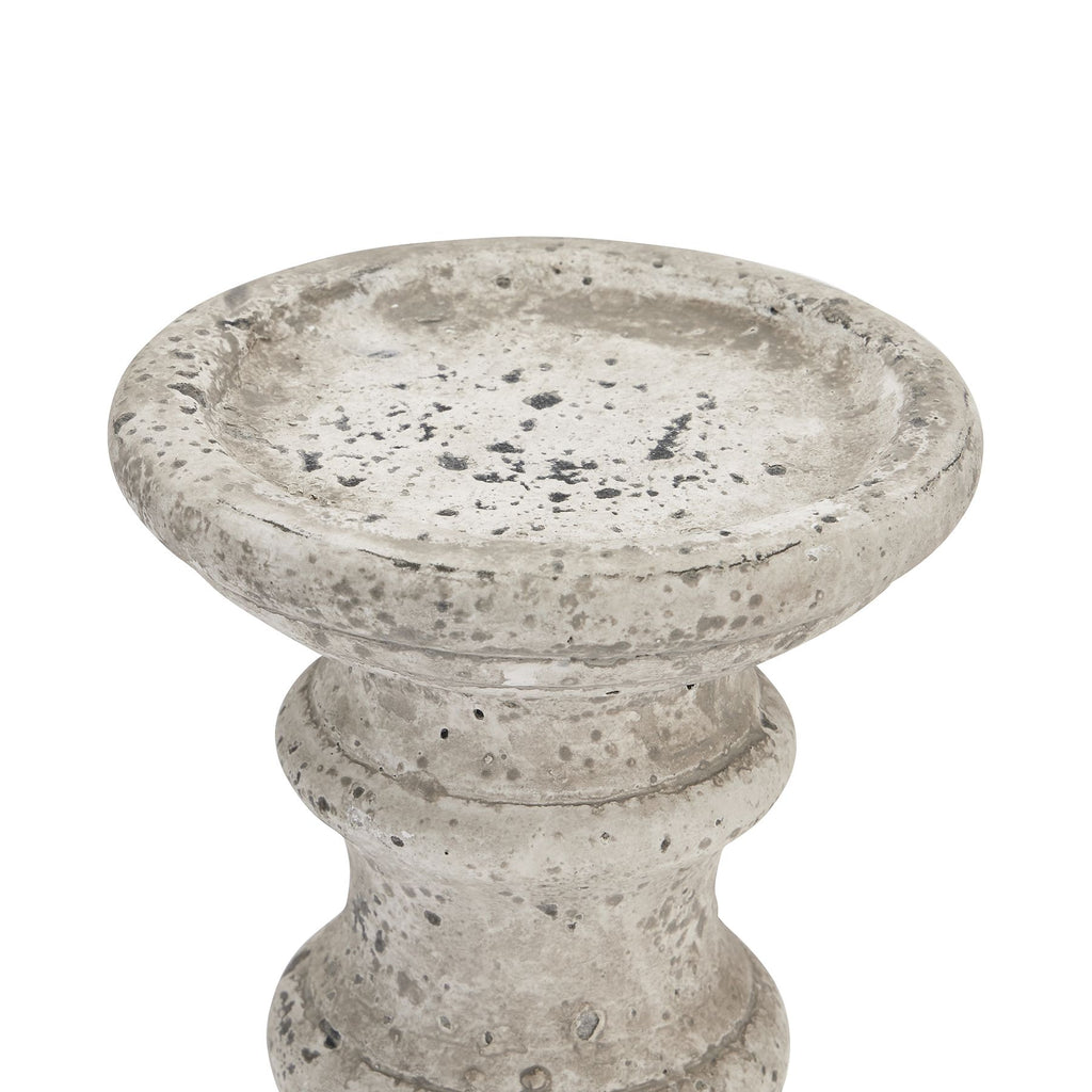 Close-up of the candle holder's broad shallow top recess, rounded rim and grey and charcoal markings.