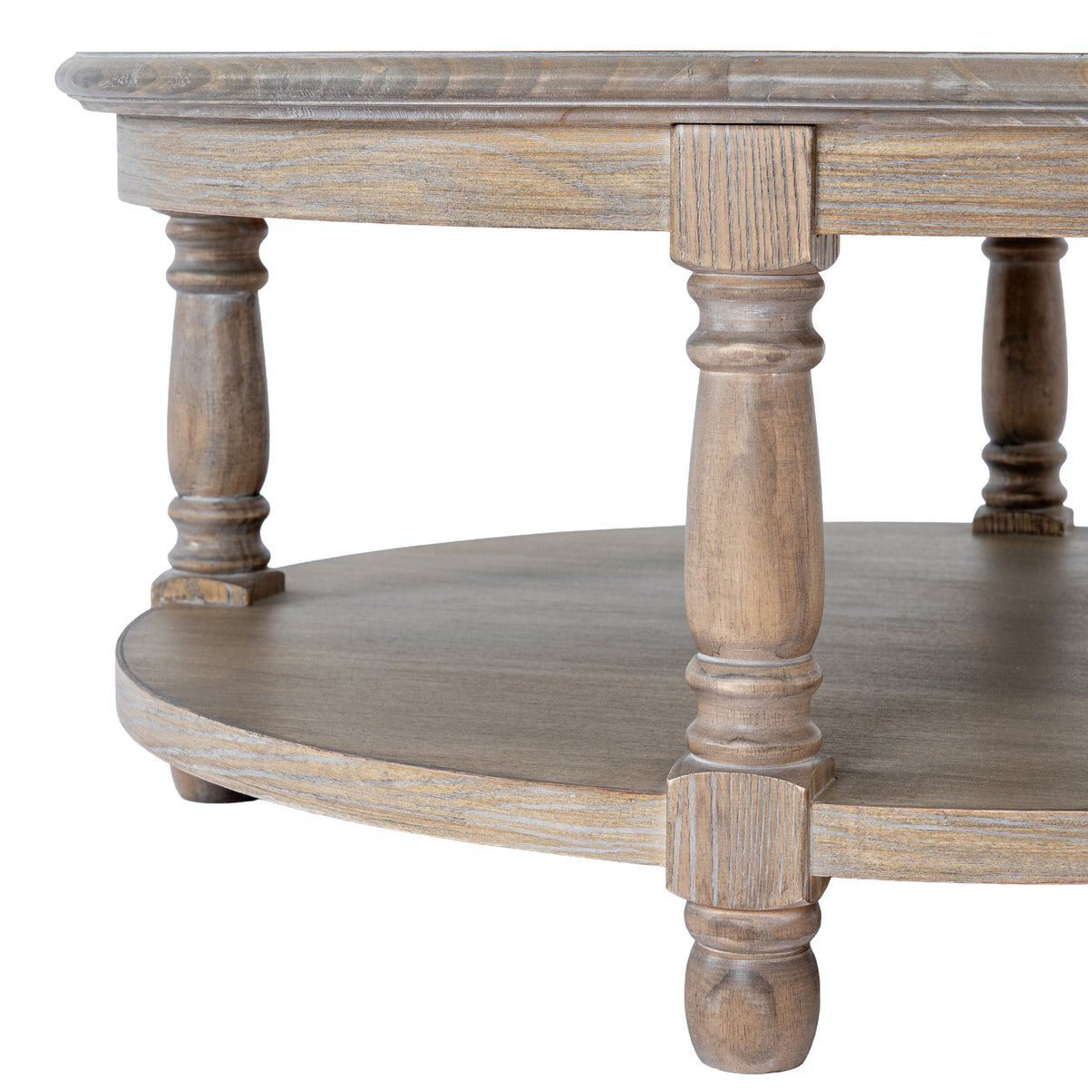 Close view of the coffee table's ringed leg profiles, curved apron and open lower shelf, showing pale grey tones across the brown grain.