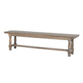 Brown backless dining bench with a long moulded-edge seat, four turned-profile legs and low connecting rails, viewed at an angle.