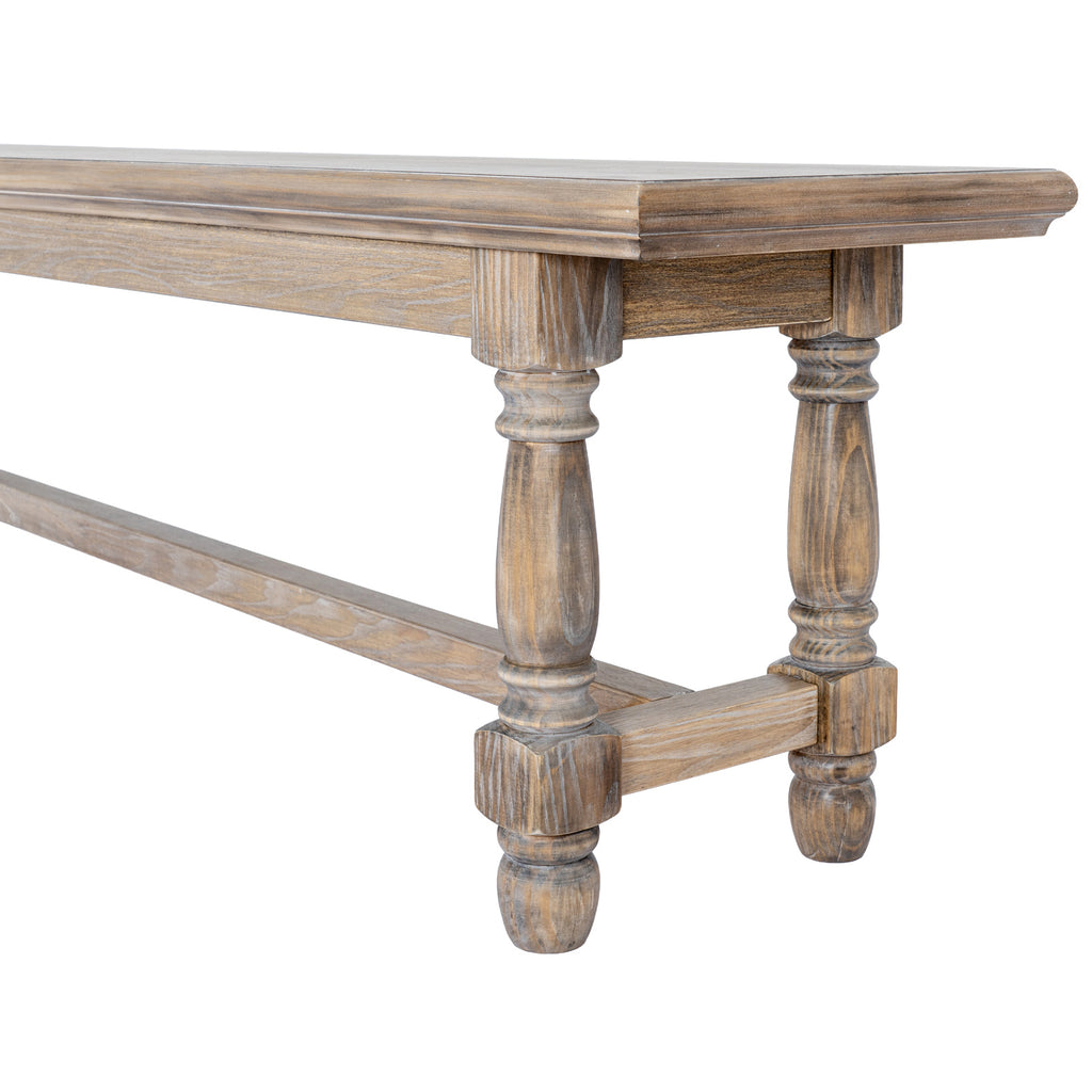 Detail of one end of the brown bench showing the moulded seat edge, shallow apron, shaped legs and low end stretcher.