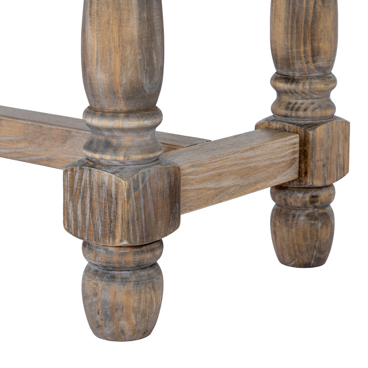 Close view of the bench's lower leg profiles and square sections beside the end stretcher, with contrasting brown grain visible.