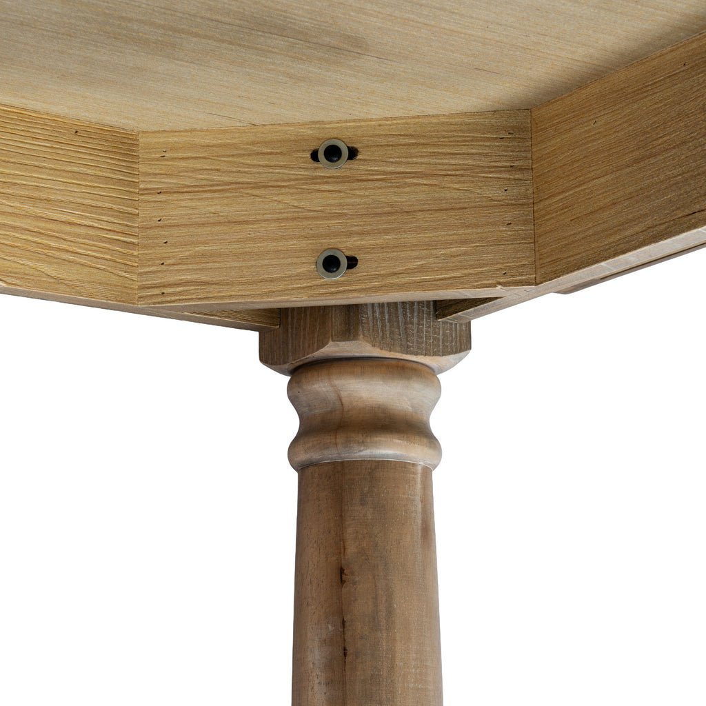 Underside corner detail showing two dark circular fittings in the apron and the rounded upper profile of a brown table leg.