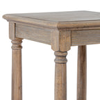 Close-up of the side table's square top corner, showing the contoured edge, shallow apron and curved detail at the top of the legs.