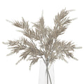 Grouped taupe artificial foliage in a clear vase, with narrow pointed leaves, brown branching stems and pale clustered spikes against a white background.