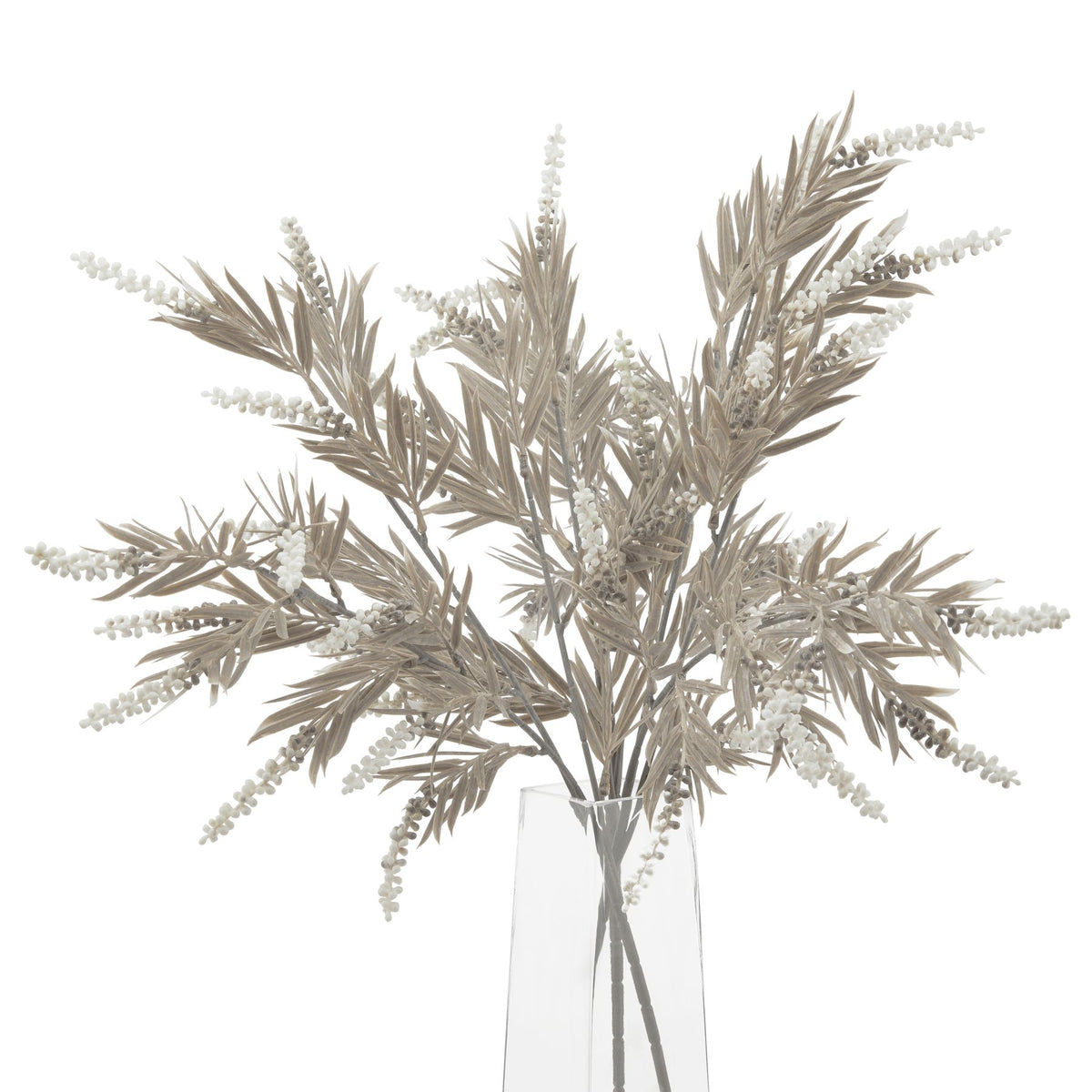 Grouped taupe artificial foliage in a clear vase, with narrow pointed leaves, brown branching stems and pale clustered spikes against a white background.