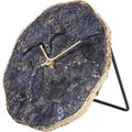 Angled view of a smoky agate mantel clock with an irregular gold-coloured edge and black rear support.