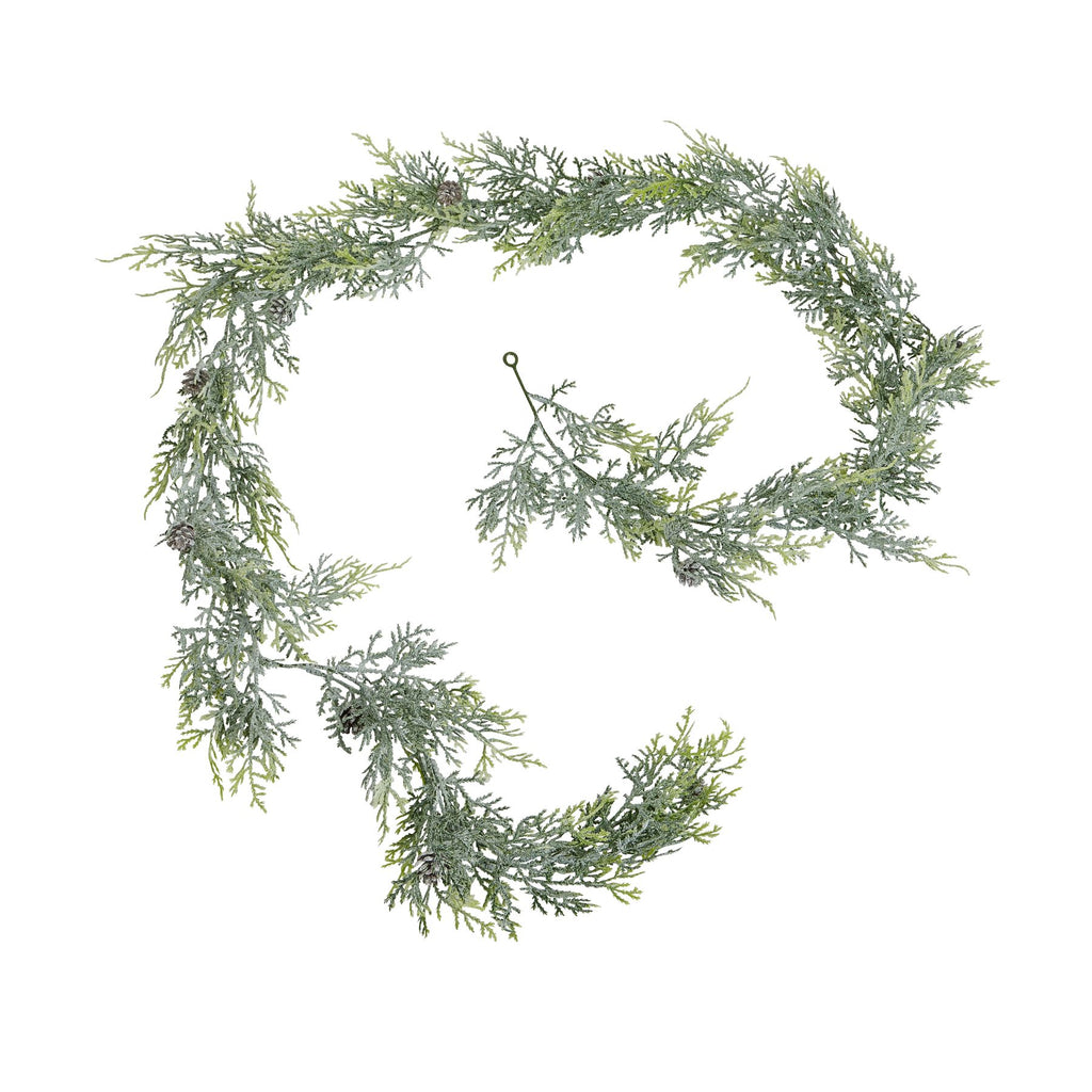 Frosted green artificial pine garland arranged in a loose spiral on white, with pinecones spaced among the branches.
